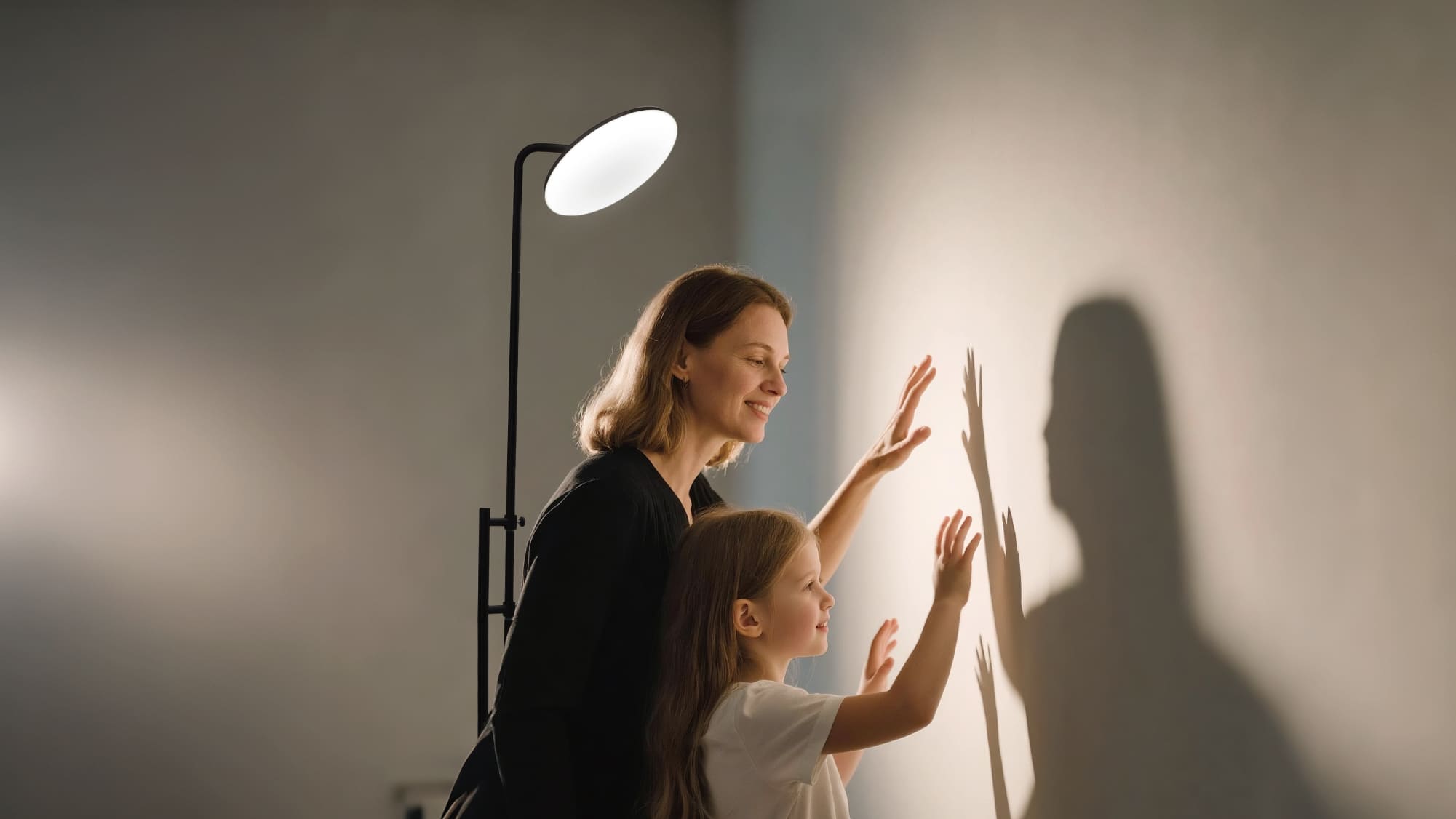 A Sunmory floor lamp casting a warm, gentle light over a child who is reading a book, while a parent looks on with a smile, showing how the lamp protects the child’s eyes.