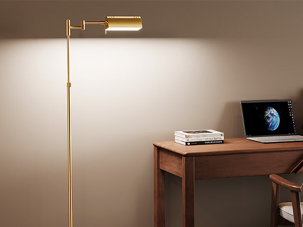 Adjustable Pharmacy Floor Lamp with 1500 LM LED light focused over a wooden desk for reading and concentrated work