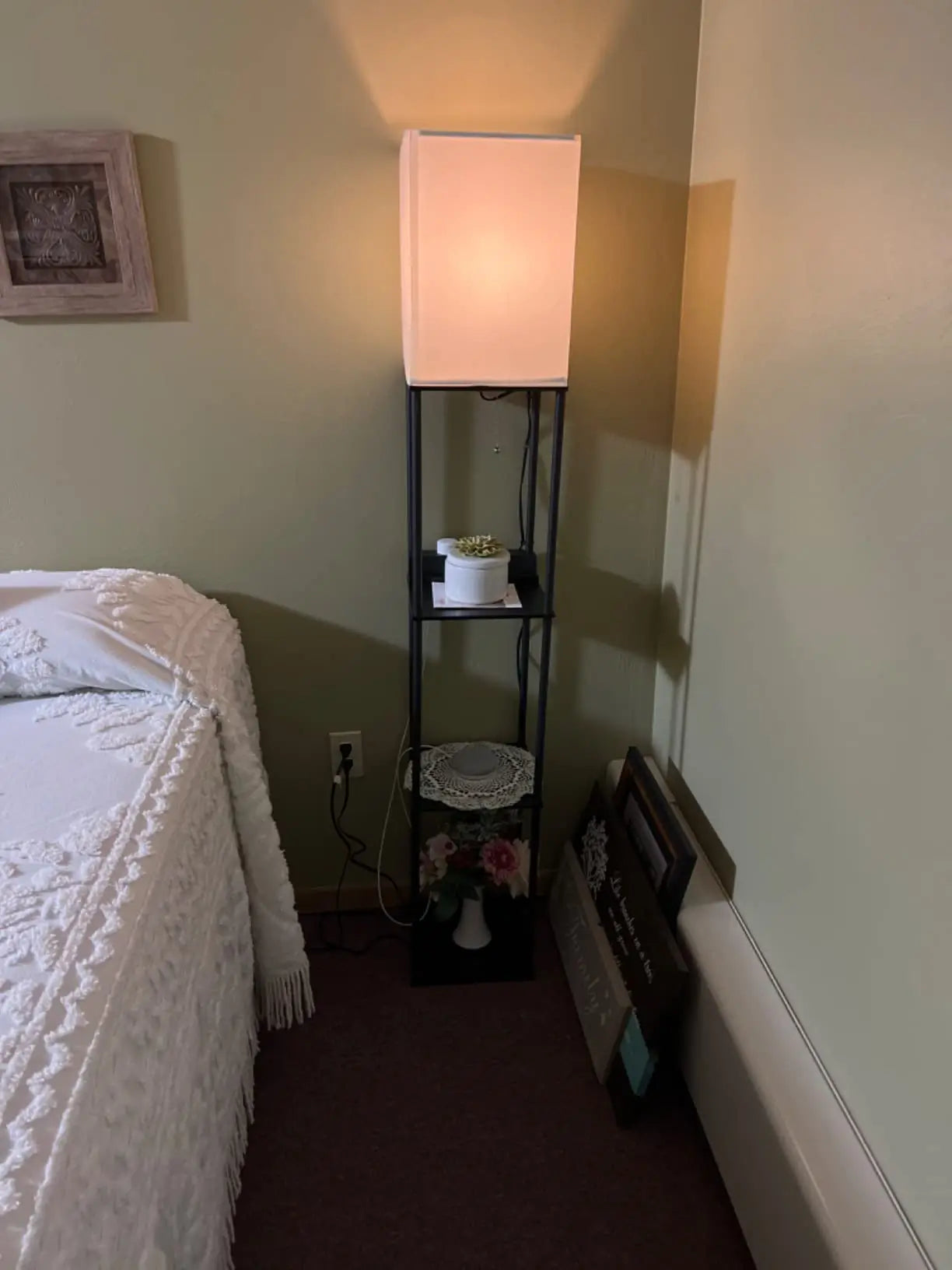 An adjustable RGB floor lamp displaying a vibrant blue hue, offering full control over color and brightness through its remote or smartphone app for personalized room ambiance.