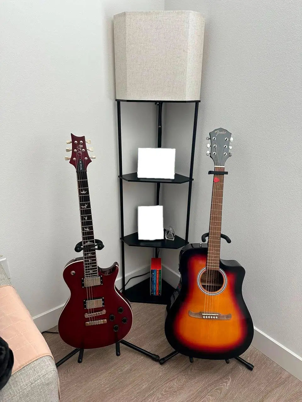 A contemporary corner floor lamp with integrated bookshelves, providing functional lighting and a stylish storage solution for a modern reading nook.