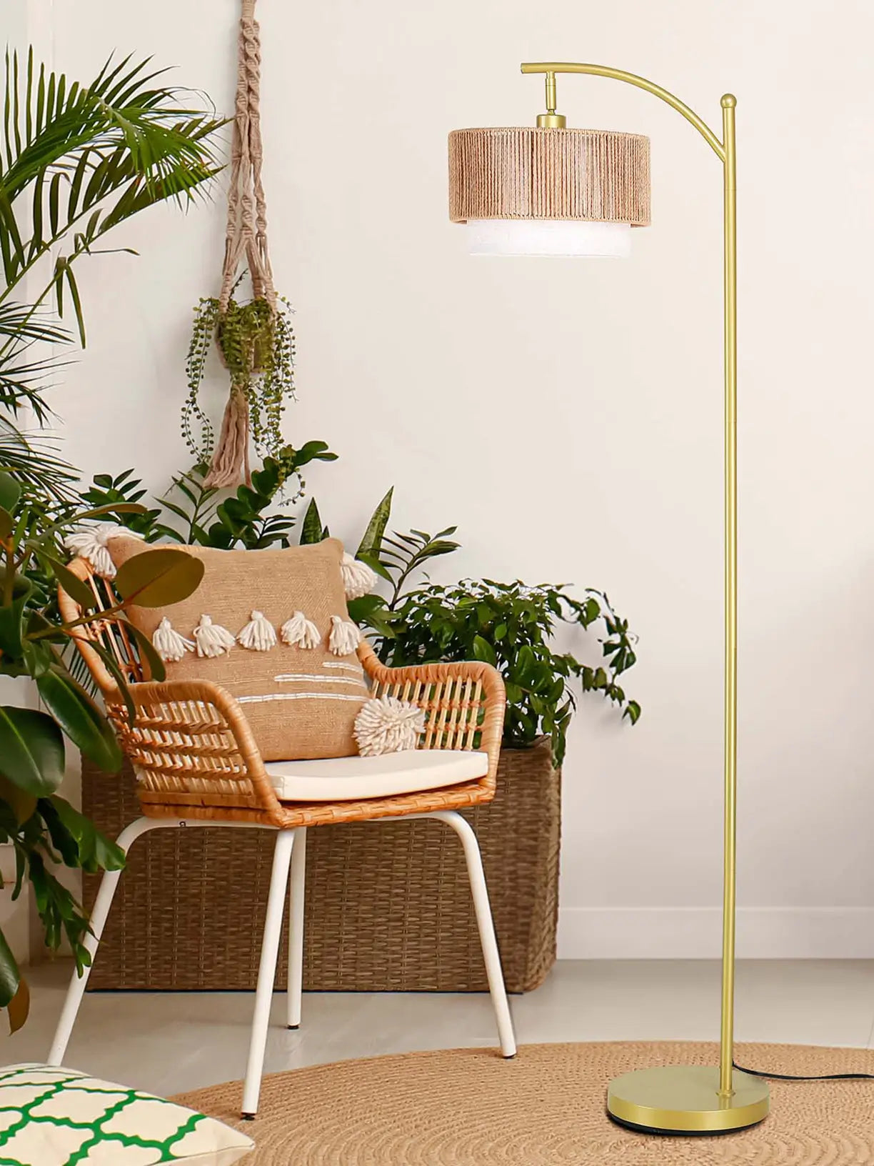A contemporary double lampshade floor lamp with a natural wood-effect base and two fabric shades, offering a warm and inviting glow, blending seamlessly with a rustic or modern interior.