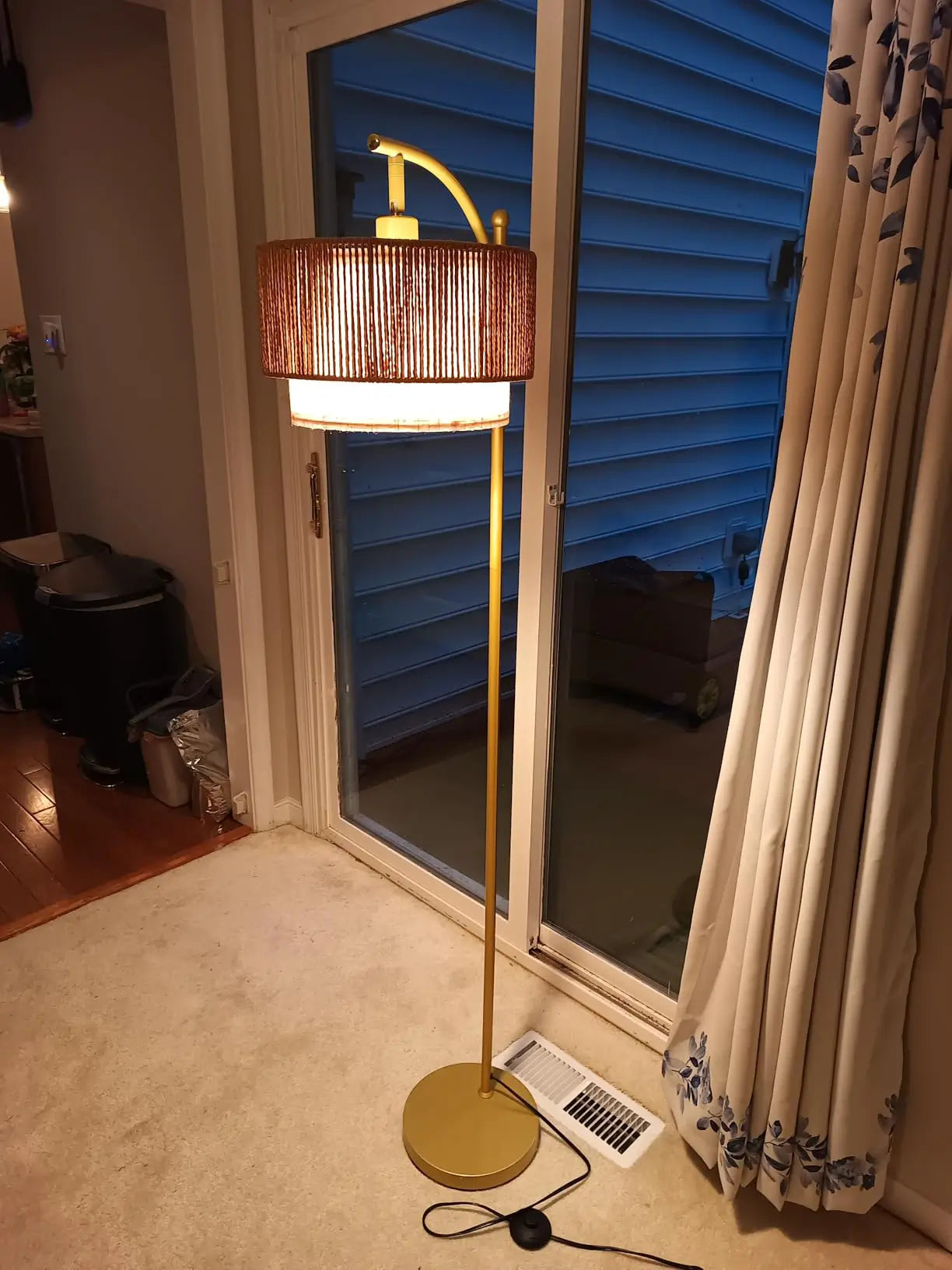 Double lampshade floor lamp with two independently adjustable lamp heads, offering flexible task and ambient lighting, ideal for reading or general room illumination.