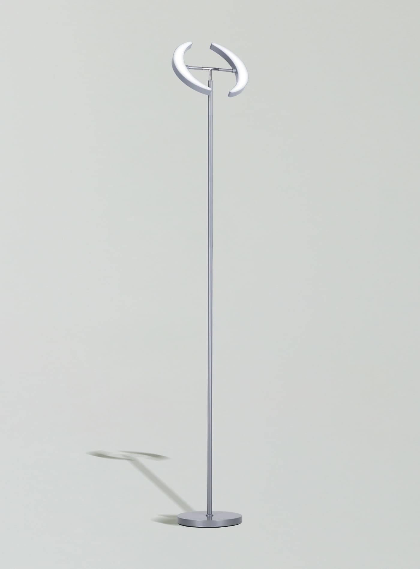 An elegant gray Sunmory Dual-Moon LED floor lamp with a heavy-duty base, providing a stylish and stable lighting solution for an office